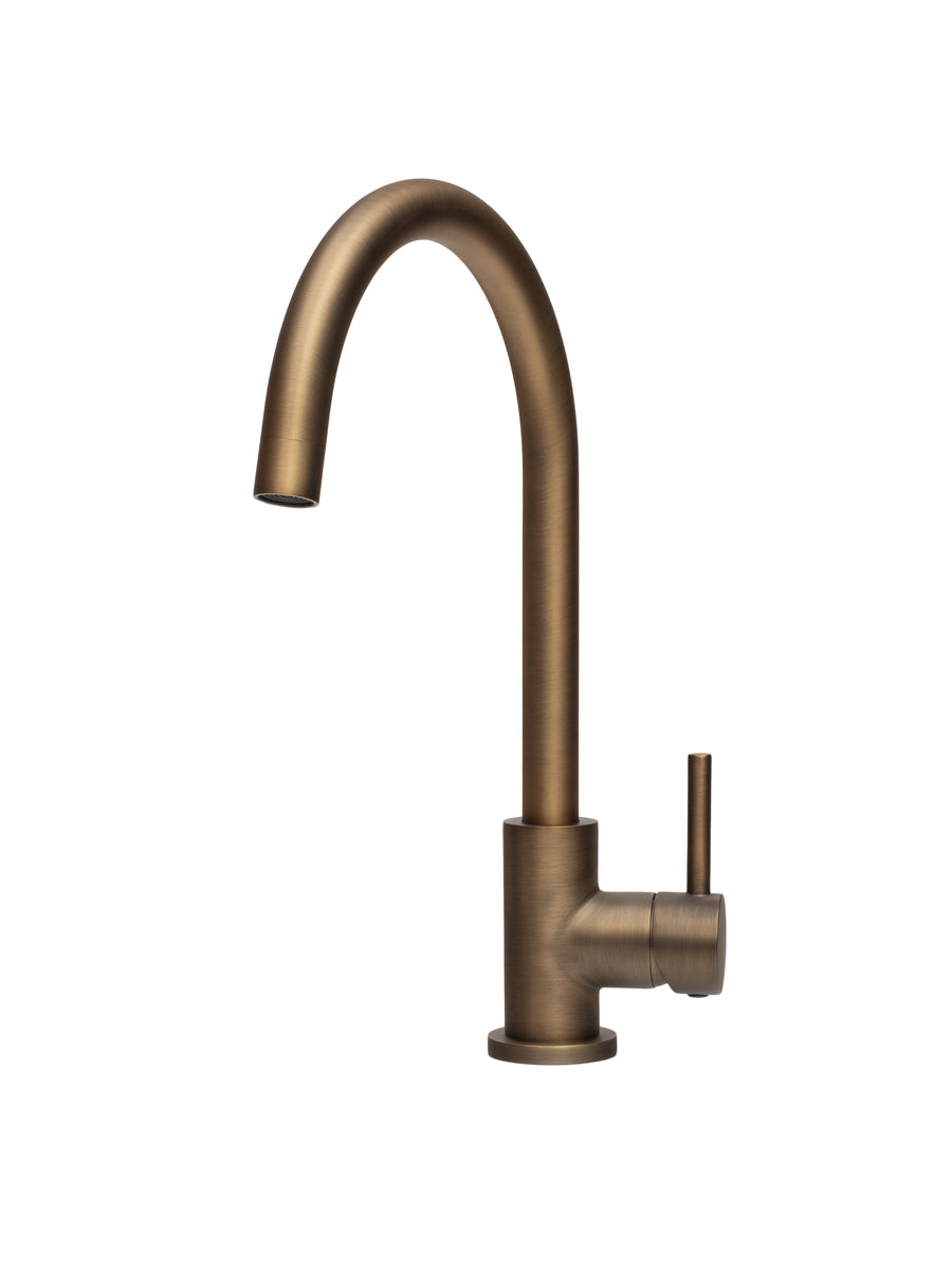 Tigar Bathrooms Essence antique brass kitchen and laundry mixer tap with WELS 6-star rating, featuring a sleek, vintage-style design.